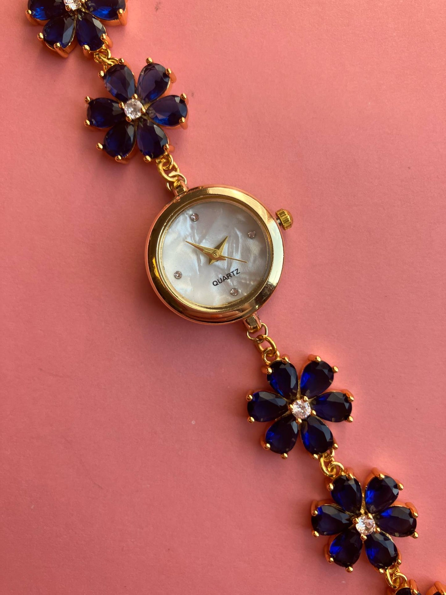 Gold Flower Watch with Dark Blue Stones