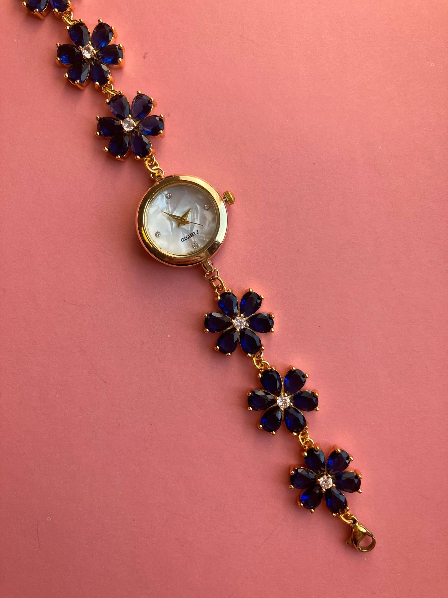 Gold Flower Watch with Dark Blue Stones