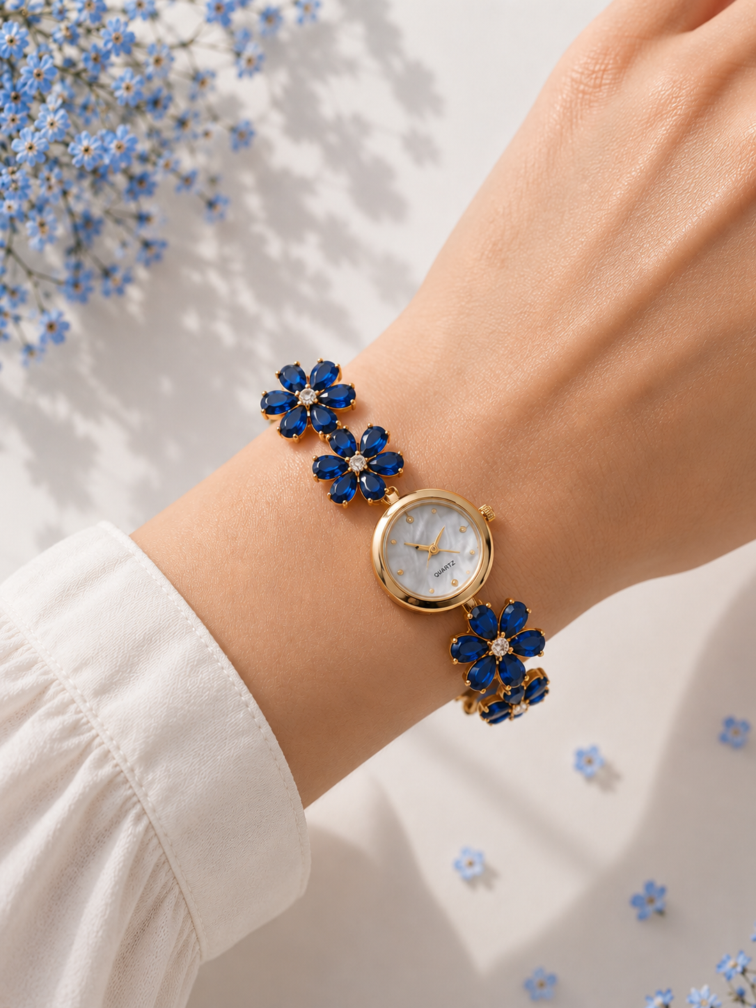 Gold Flower Watch with Dark Blue Stones